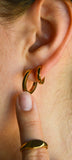 Mini hoop earrings on model