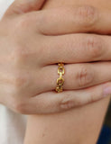 Chainlink gold ring on models finger